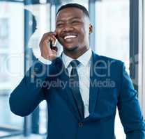 One call could open up many opportunities. a young businessman using a smartphone in a modern office.