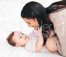 Mommy loves you plenty. a woman bonding with her adorable baby boy at home.