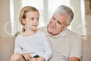 The family is one of natures masterpieces. a grandpa and his granddaughter at home.