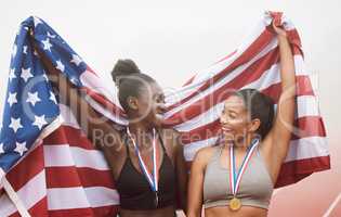 Theyve got that winning mentality. two attractive young female athletes celebrating their countrys victory.