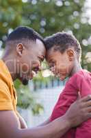 The most important lessons are learnt with love. an adorable little boy sharing an affectionate moment with his father in a garden.