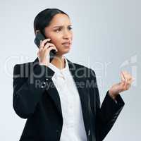 It is the person who craves more, that is poor. a young business woman using a phone against a grey background.