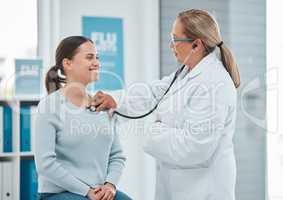 Ive been taking better care of myself, doctor. a doctor examining a patient with a stethoscope during a consultation in a clinic.