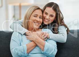 Having you around is a blessing. a young woman hugging her mother.