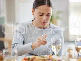 No-one cooks like mom. a young woman enjoying her meal with her family at home.