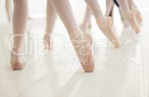 I am closer than I was yesterday. a group of unrecognizable ballet dancers during their rehearsal in a studio.