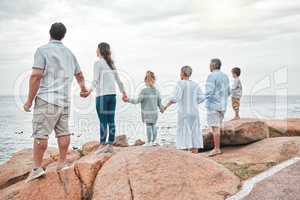 As certain is the tide, so is our love. a happy family enjoying a day along the coast.