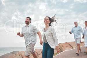 Get out there and make more memories. a happy family enjoying a day along the coast.