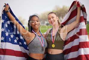 We did our country proud. Cropped portrait of two attractive young female athletes celebrating their countrys victory.