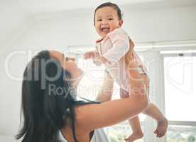 Youve given me even more reason to smile. an attractive young woman and her newborn baby at home.