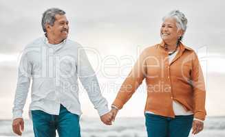 Romance never dies. an affectionate senior couple sharing an intimate moment on the beach.