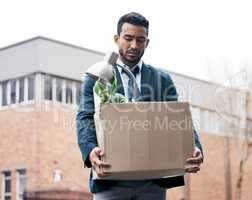 Its failure that gives you the proper perspective on success. a young businessman looking depressed after being retrenched from work.