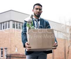 When you take risks you learn. a young businessman looking depressed after being retrenched from work.