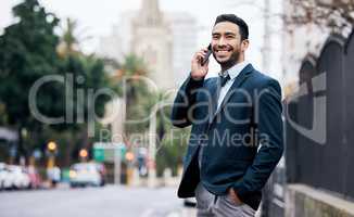 Someday is not a day of the week. a handsome young businessman standing in the city and using his cellphone.