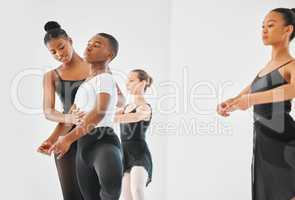 Give your talent room to grow. a young woman teaching a young boy ballet in a dance studio.
