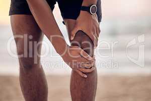 Rest is what I need to recover from this. Closeup shot of an unrecognisable man experiencing knee pain while exercising outdoors.