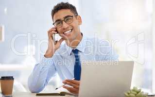 Business calls are a great opportunity. a young businessman using his smartphone to make a phone call.