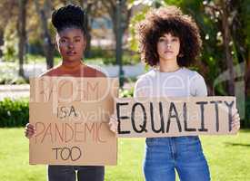 Without debate no country can succeed. a two young women protesting outside in the park.