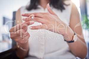 Always remember your worth. an unrecognizable woman removing a ring from her finger at home.