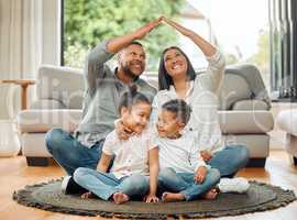 Always make time for your heart owners. a young family playing with their kids on the lounge floor at home.