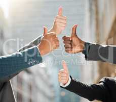 Hit us with your best shot. a group of business people giving the thumbs up.