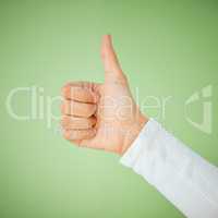 Ill handle this one. an unrecognizable woman showing a thumbs up against a green background.