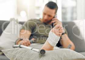 Pain is temporary. a unrecognizable man relaxing his foot on a table at home.