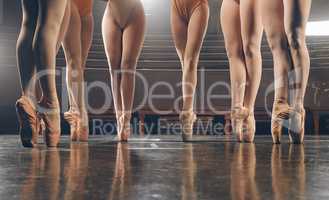 Great dancers are not great because of their technique. a group of ballerina dancers practicing a routine in their pointe shoes.