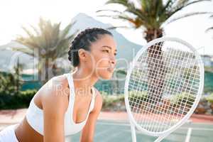 When the ball strikes, Ill be ready. a sporty young woman playing tennis on a court.