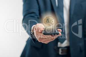 Theres risk and reward behind trading in bitcoin. Closeup shot of an unrecognisable businessman holding a cellphone with a bitcoin hovering on top against a white background.