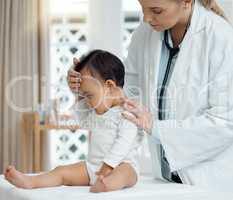 Doctor is highly concerned about the little ones wellbeing. a paediatrician examining a baby in a clinic.