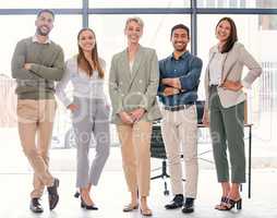 This team will carry you to success. Full length shot of a diverse group of businesspeople standing together in the office.