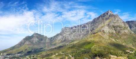 Panoramic view of Table Mountain against a cloudy blue sky with copyspace. Vibrant, beautiful landscape of nature. A popular location in Cape Town for travel, hiking and adventure