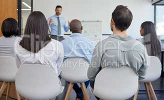 Extra training to ensure that were the best. a handsome mature businessman giving a presentation in the conference room.