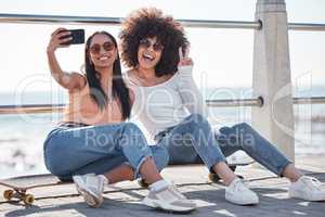 Best friends till the end, better half no pretend. two young friends taking selfies together at the promenade.