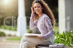 Chasing my dreams. a young female student studying in nature.