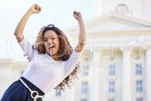 No medicine cures what happiness cannot. a young woman celebrating outside.