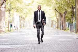 Enjoying his morning commute. Full length portrait of a handsome young businessman on his morning commute into work.