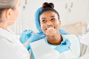 Youve really been caring for your teeth. a young woman at her dental checkup.
