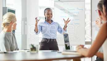 Lets go out there and have a successful week. a young businesswoman giving a presentation to her colleagues in an office.