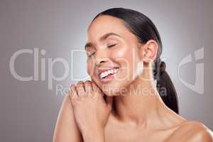 Beauty is about celebrating your individuality. Studio shot of a beautiful young woman posing against a grey background.