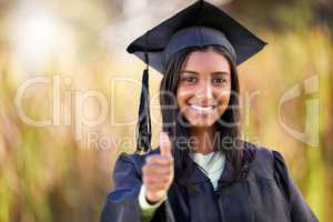 No substitute for education. Cropped portrait of an attractive young female student celebrating on graduation day.