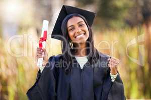 Years of hard work paid off. Cropped portrait of an attractive young female student celebrating on graduation day.