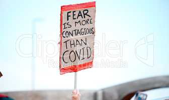 Understanding the extent of of their plans. Cape Town, South African - October 2, 2021 Unrecognisable demonstrators holding up signs and protesting against the Covid 19 vaccine.