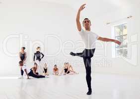Poise is the finest point of balance. a group of ballet dancers practicing a routine in a dance studio.