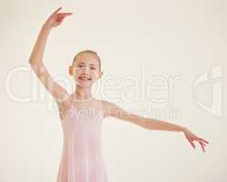 Ballet technique is arbitrary and very difficult. a young ballerina dancing in a studio.