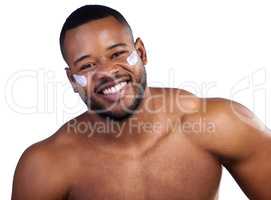 My skins happy, so Im happy. Studio portrait of a handsome young man moisturizing his face against a white background.