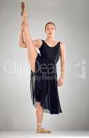 No amount of rehearsal can prepare you for the real thing. Full length portrait of an attractive young female ballet dancer in studio against a grey background.