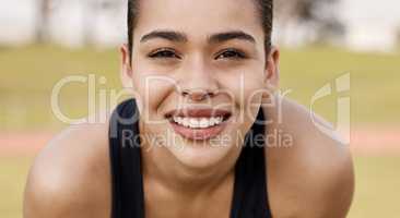 Its time to burn some calories. an attractive young woman getting ready to play sports outside.