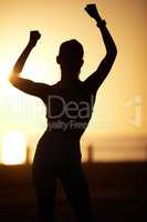Stay hopeful about every new day. Silhouetted shot of a woman cheering outdoors.